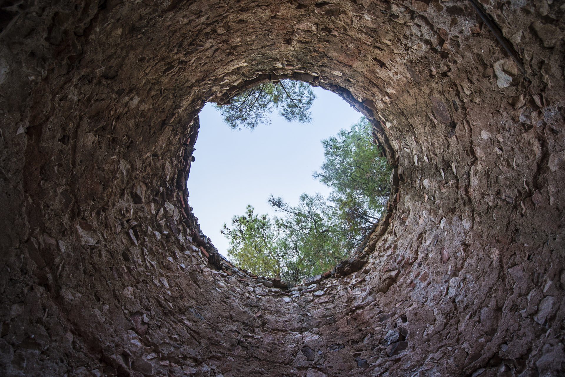Looking up through an old ore kiln at Metalia, Limenaria